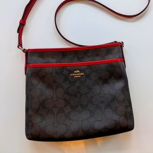 Coach Leather Crossbody Handbag with red trim